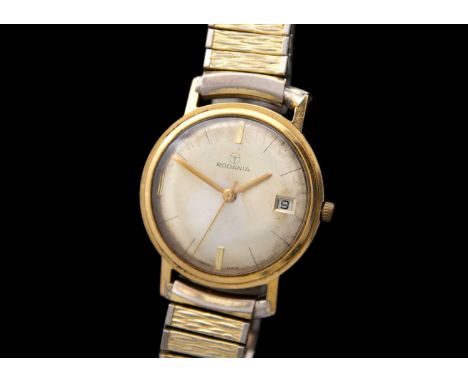 RODANIA - A 9ct cased 1960's gentleman's manual wind wristwatch. The signed 28mm silvered dial with date aperture, unsigned 1