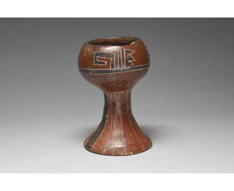 An Aztec gobletMexico, circa 1300 - 1521 ADpottery, with an incised band of three repeating symbols, with red and black decor