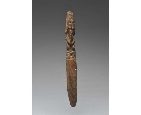 A Taino ritual vomit spatulaGreat Antilles, circa 1000 - 1400 ADcurved and carved a skeletal tree frog with enlongated foreli