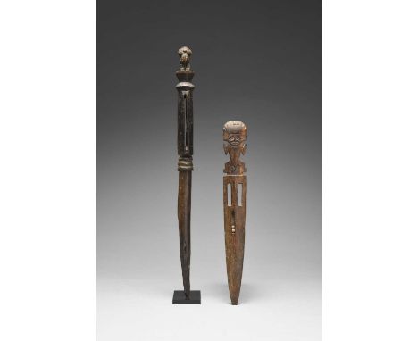 A Chimu implement / sceptrePeru, circa 1100 - 1400 ADthe burnt blade to an open rattle handle, containing seeds, with a finia