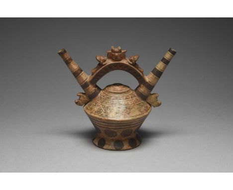 A Lambayeque double spout stirrup vesselPeru, circa 700 - 1200 ADpottery, with a deity head flanked by two lying figures and 