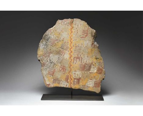 An Inca Chucu stone tabletPeru, circa 900 - 1400 ADdecorated figures, animals and dots, divided by a vertical wavy line in re