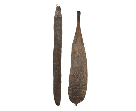 An Aboriginal churingaAustraliawith carved channelled and dot decoration to the front and textured to the curved back, with a
