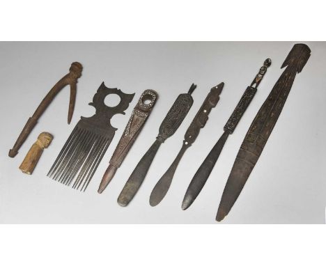 Three Massim lime spatulasTrobriand Islands, Papua New Guineaone with a carved figure terminal, 42.5cm long, one carved an an