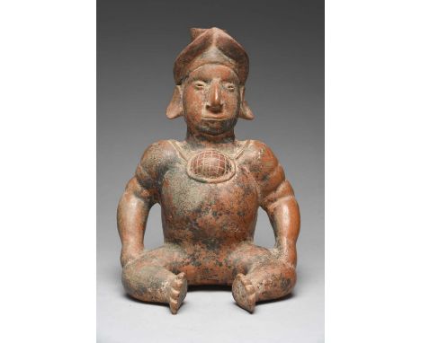 A Jalisco seated male figureMexico, circa 100 BC - 200 ADpottery, with a spout to the head and a wearing a rimmed headdress a