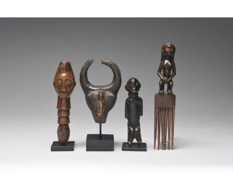 An Angola combwith a standing female figure handle, with inset glass bead eyes,20.5cm high,a Nigerian miniature standing figu