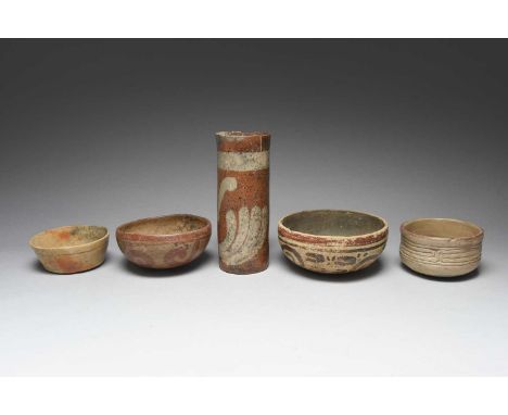 A Maya cylindrical vesselMexico, circa 250 - 950 ADpottery, with two painted stylised leaf designs,13.5cm high,two Maya potte