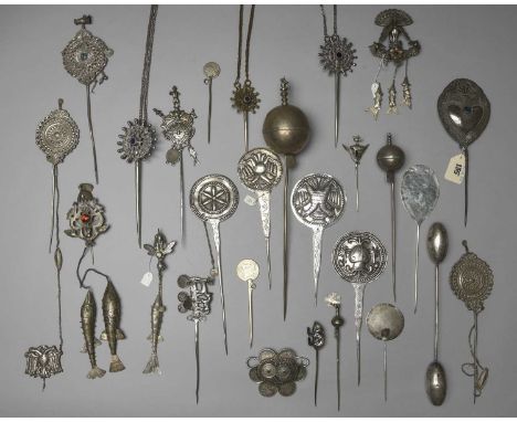 A collection of South American cloak pinsBolivia and Mapuchesilver coloured metal, including six with pierced disc ends, five