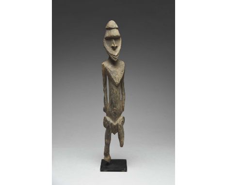 A Lower Sepik River standing female figurePapua New Guineawith a nodule to the back of the neck and concentric rings to the n