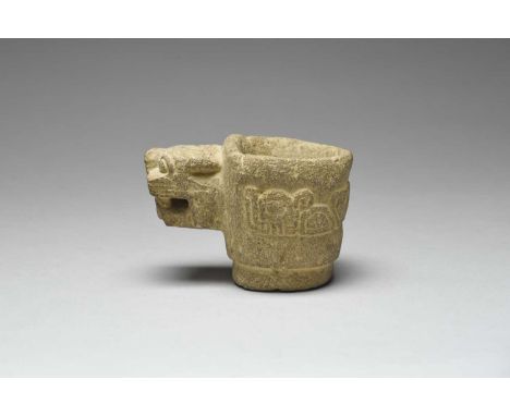 A Chavin mortarPeru, circa 500 - 200 BCstone, with a relief jaguar head and the sides with stylised zoomorphic designs,8.5cm 