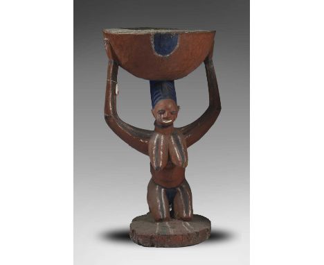 A Yoruba shrine bowl arugba shangoIla-Orangun, Nigeriawith a kneeling maternity figure with a child strapped to her back, wit