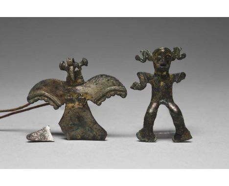 A Cocle tumbaga pendantWestern Peninsula, Panama, circa 800 - 1500 AD of a standing male figure with two S shape head ornamen