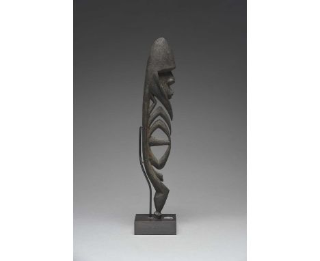 A Karawari River small hunting charm yipwon Papua New Guineawith an encrusted patina,36cm high, on a stand. (2)ProvenanceDr L