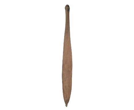 An Aboriginal spear thrower woomeraAustraliathe concave front carved meandering lines, with remains of a sinew bound wood poi