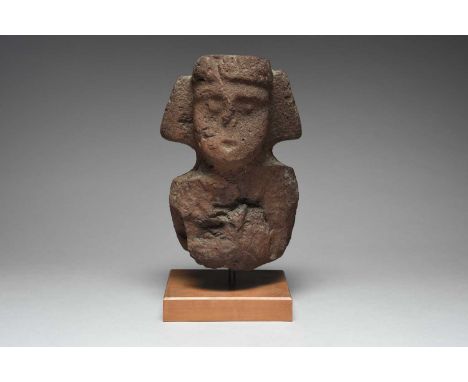 A Totonac bustVeracruz, Mexico, circa 600 - 900 ADbasalt, carved with a headdress and ear ornaments, with a red/brown pigment