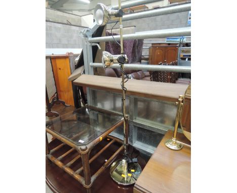A modern brass reading/standard lamp