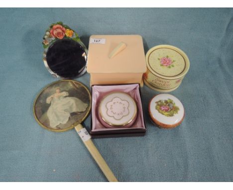 A selection of dressing table items including early plastic trinket box