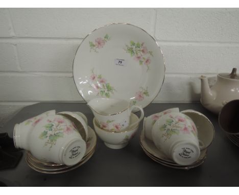 A part tea service by Royal Stuart with floral transfer print and gilt edgework 