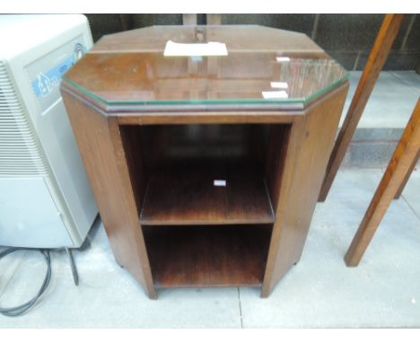 A mid 20th Century mahogany and glass top occasional table with double shelf under