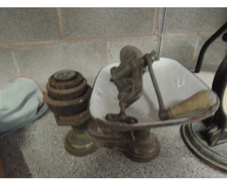 A vintage scale set with weights and mincer