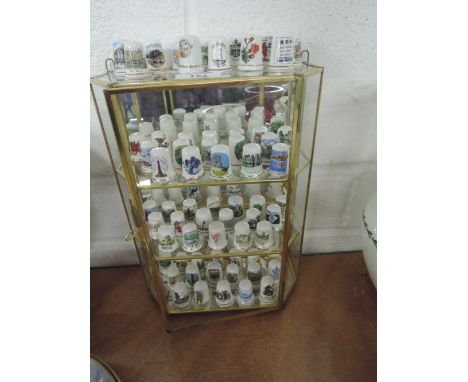 A selection of ceramic thimbles in display case