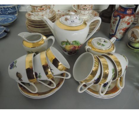 A part tea service with fruit transfer and gold gilt edge work 15 pieces
