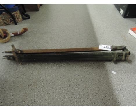 A vintage wooden folding tripod 