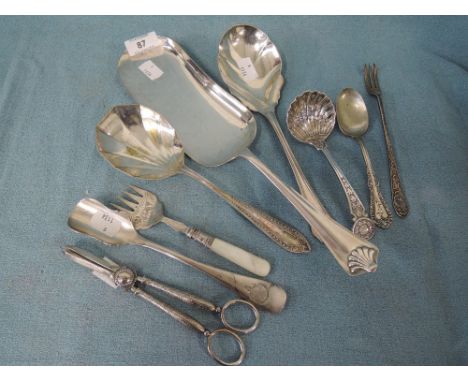 A selection of vintage cutlery and table wares including stilton spoon