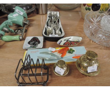 A miscellaneous selection including Italian ceramic dishes, decorative flatware, Lobster crackers, brass bells and plated toa