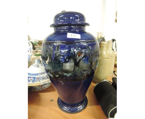 A large ceramic lidded urn with pierced decoration
