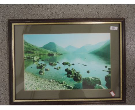 A framed lakeland scene print