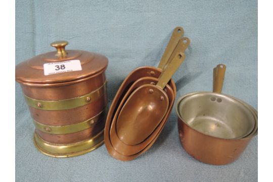 A Selection Of Copper Kitchen Items Including Graduated Scoop And