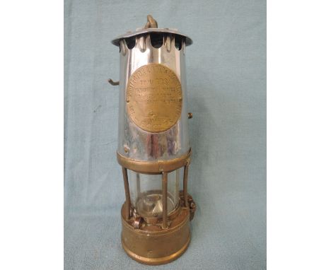A vintage brass and cast miners lamp by The Protector Lamp co. Eccles, Type SRS no.3/28 Collier 