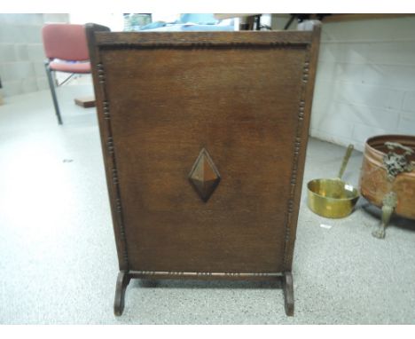 A treen folding fire screen with interior storage for haberdashery items