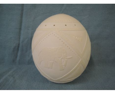 A vintage Ostrich or similar egg of large size, with carved middle eastern relief decoration