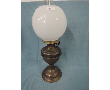 A large brass oil burning lamp by Duplex with opaline glass shade