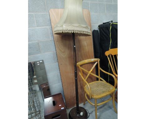 A stained frame standard lamp
