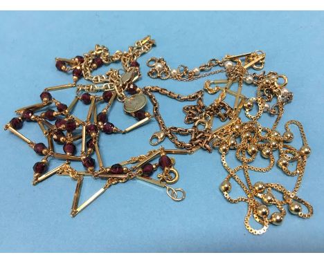 Two 9ct gold necklaces and a bracelet, weight 21.2g, an 18ct gold chain stamped 18 k 3.8g a beaded 9ct gold necklace and a br