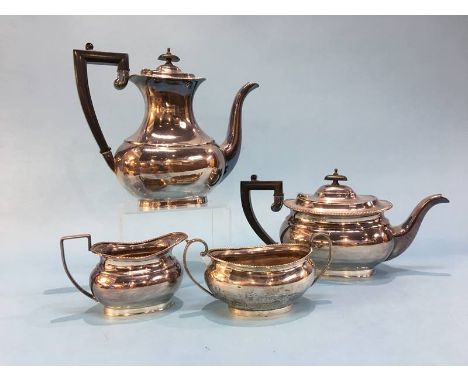 A silver three piece tea service, E.H. Parkin and Co., Sheffield, 1964, together with a similar silver sugar bowl, 62.7 oz