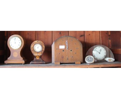 AN EIGHT DAY ASPREY TRAVEL ALARM CLOCK with brushed aluminium case together with a mantle clock and three further clocks