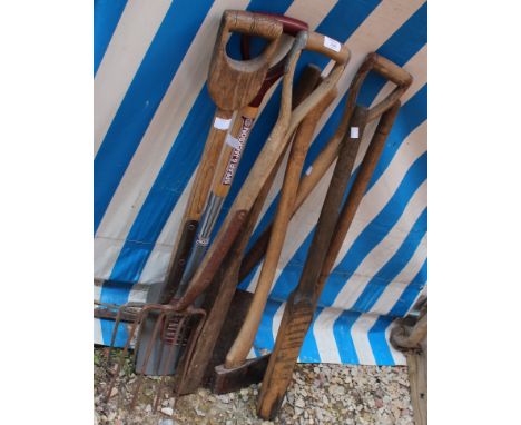 A COLLECTION OF OLD TOOLS to include spades, forks and an axe
