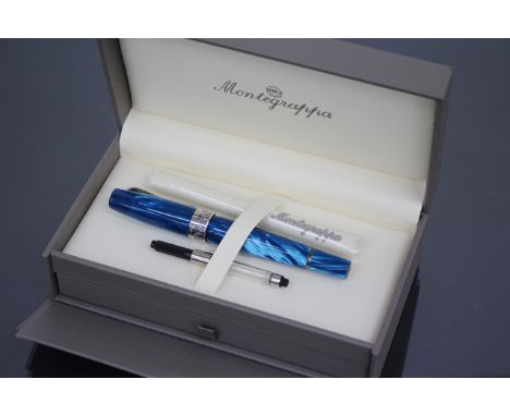 A MONTEGRAPPA FOUNTAIN PEN in turquoise blue celluloid with white metal mounts and original box