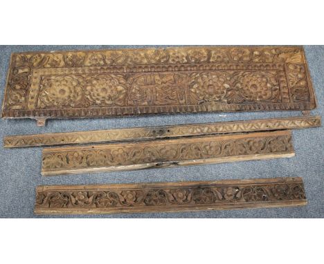 A SMALL GROUP OF ORIENTAL CARVED HARDWOOD ARCHITECTURAL ELEMENTS, the largest piece 115cm wide