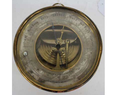 A 19TH CENTURY LACQUERED BRASS CIRCULAR WALL HANGING BAROMETER AND THERMOMETER with silvered dial and suspension ring, 13.5cm