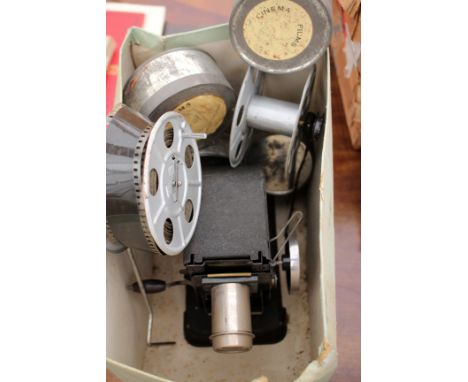 AN EARLY 20TH CENTURY BING CINE PROJECTOR together with three Givjoy comedy films to include Charlie Chaplin 