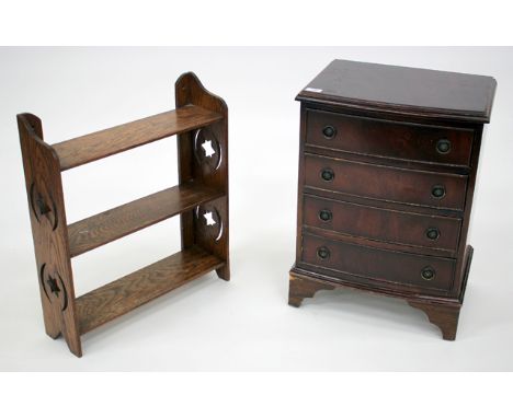 A SMALL GEORGIAN STYLE MAHOGANY CHEST OF FOUR DRAWERS standing on bracket feet together with an oak hanging wall shelf, the c