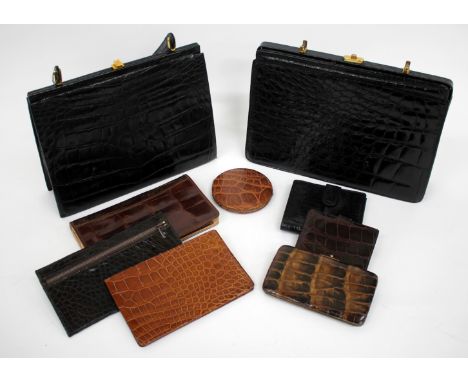 A QUANTITY OF VARIOUS CROCODILE SKIN ITEMS to include two handbags, purses, a wallet, a compact etc.