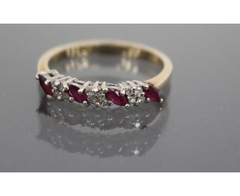 A DIAMOND AND RUBY TYPE STONE SET RING