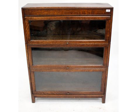 AN OAK GLAZED THREE TIER GLOBE WERNICKE TYPE BOOKCASE, 87cm wide x 112cm high