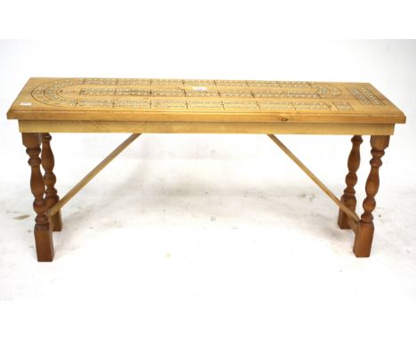 A contemporary floor standing cribbage board. L101cm x D28.5cm x D47cm